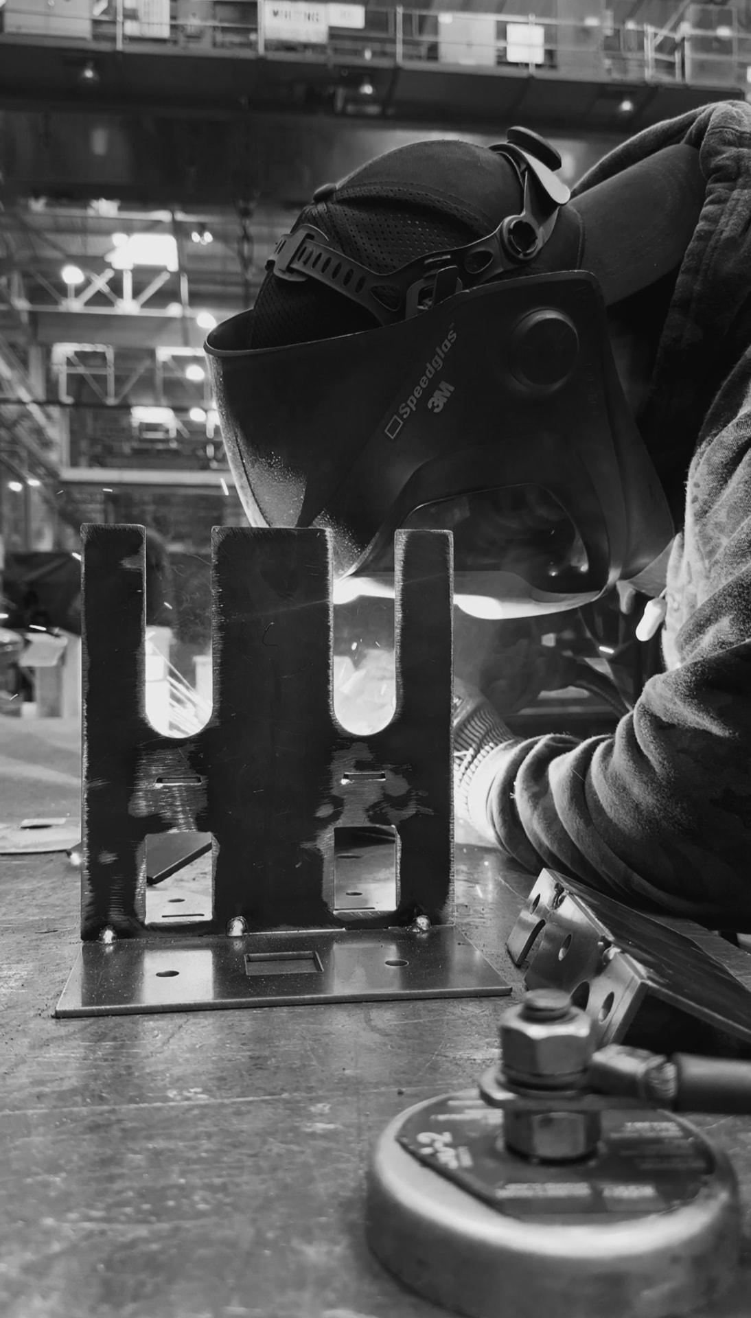 Welding a steel fixture in the shop