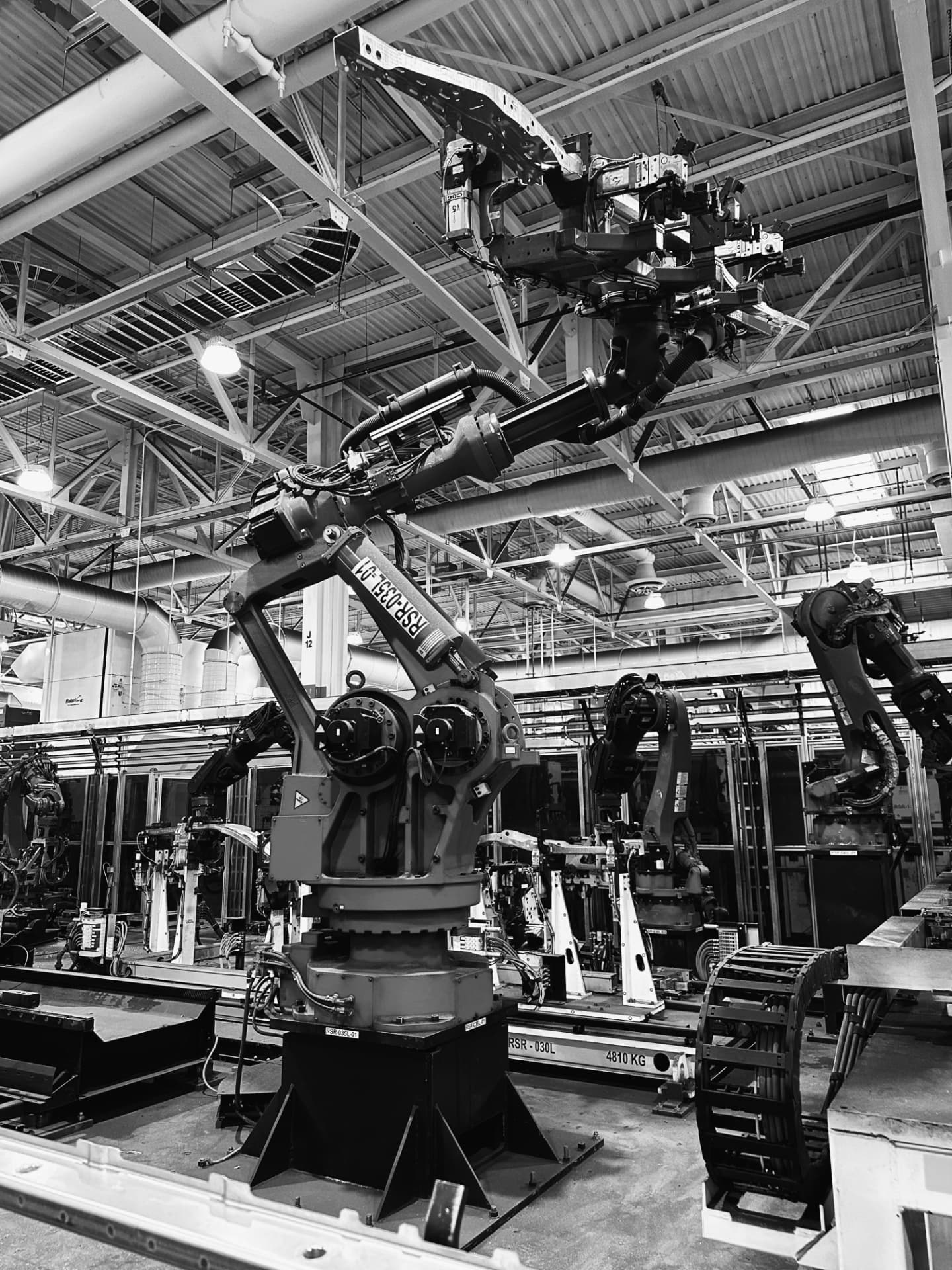 Industrial robotic arms on an automated production line